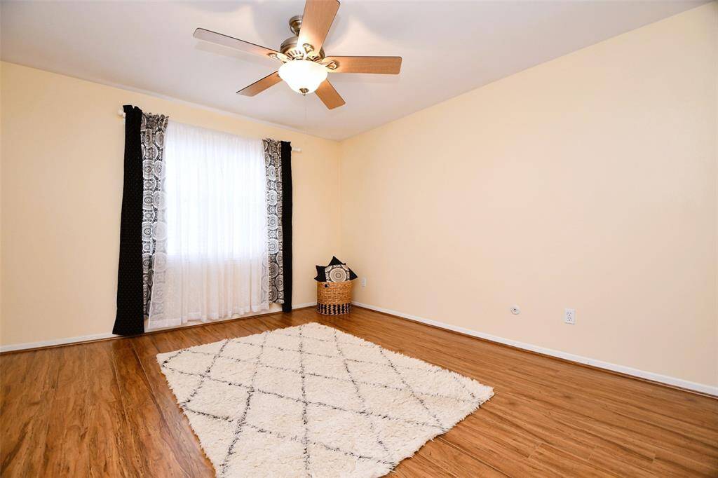 Bedroom 3 with laminate wood flooring