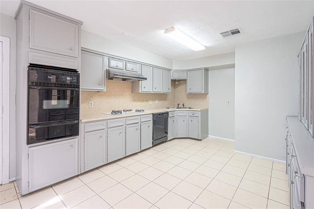 Freshly painted kitchen with tons of storage space, which is perfect for all your cooking needs and keeping things organized.