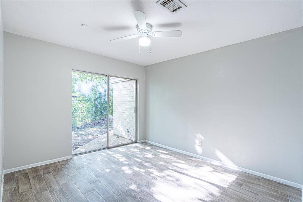 Bedroom three with its own access to the backyard makes another great spot for enjoying the outdoors right from your room.