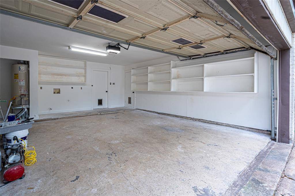 Double car garage, freshly painted with tons of storage space is perfect for your vehicles and all your extra gear!
