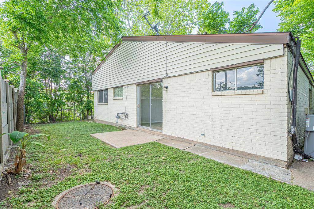 Backyard with a concrete slab, perfect for setting up furniture and enjoying the outdoors.