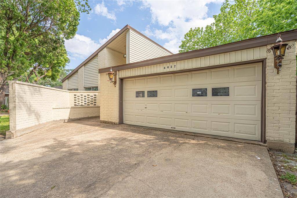 Double garage for extra storage or parking, plus a hidden front door entrance tucked behind the privacy wall makes this house stylish and secure.