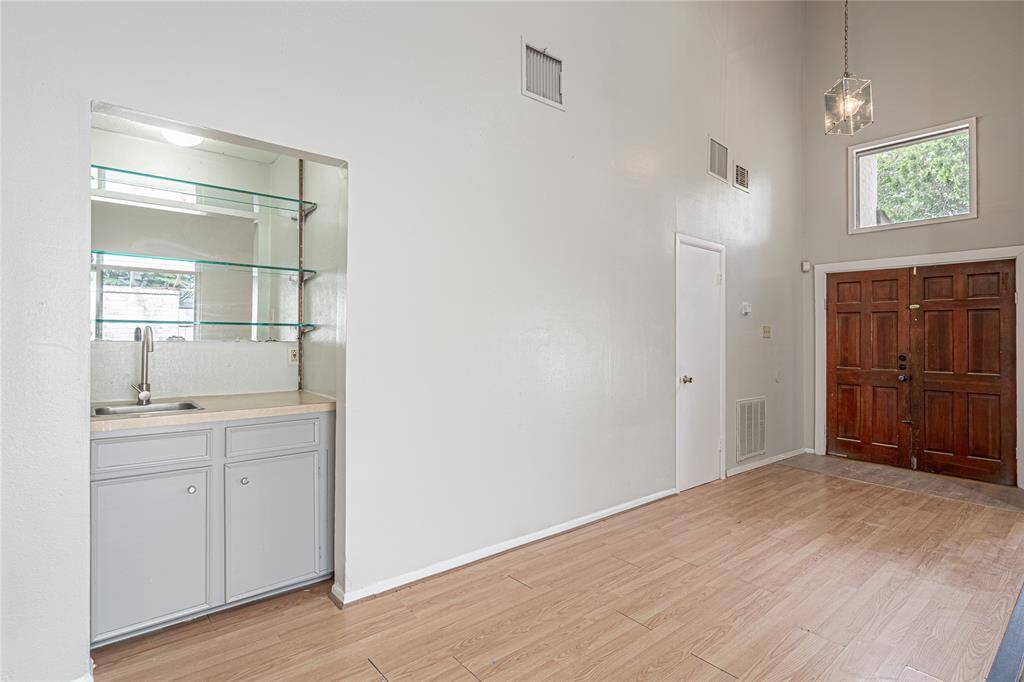 Step through the double front doors into a welcoming entryway, complete with a wet bar that’s perfect for entertaining guests right from the start.
