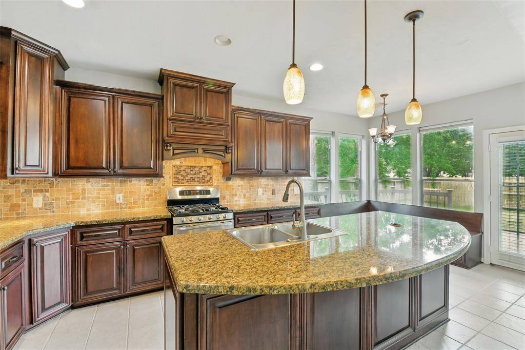 Another view looking towards the eat-in kitchen area. Lots of natural light spills over into all parts of the home.
