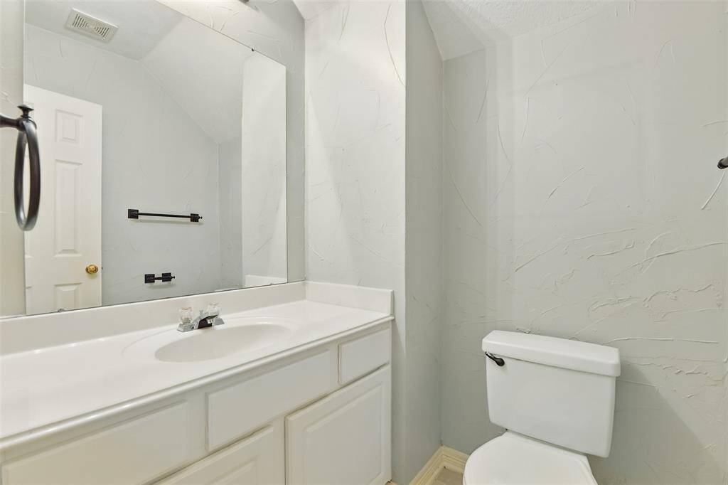 Around the corner is the half-bath.