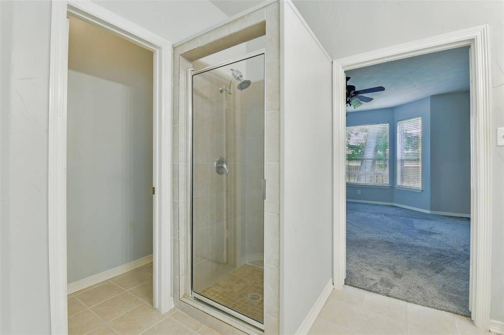 Turning around we find the separate shower and water closet leading to the toilet.