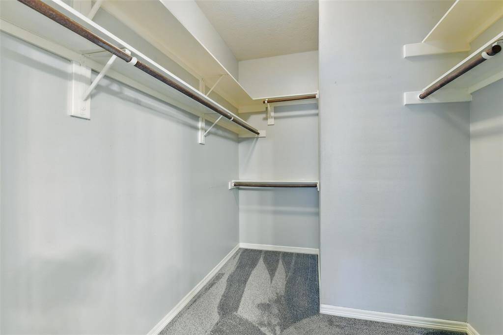 The walk-in closet doesn't disappoint with it's ample storage spaces.