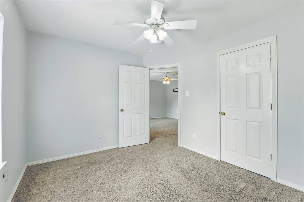 A generously sized room complete with closet.