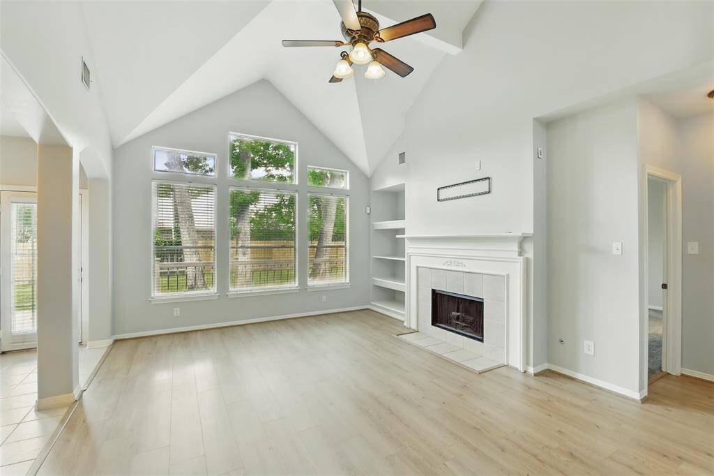Upon entering the home you are carried into the main living room. The high ceilings and neutral flooring make the space feel light and airy.