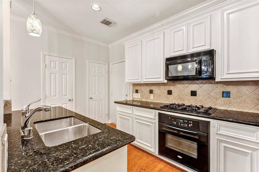 It has a double sinks, plus convenient pantry and half bath just off to the side.