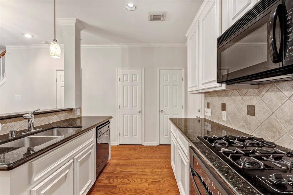 Additional view of the kitchen.