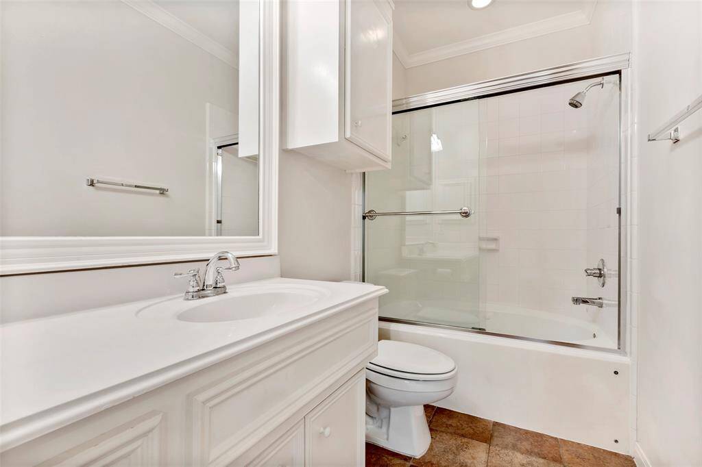 En-suite bathroom, featuring a convenient tub and shower combo for ultimate relaxation.