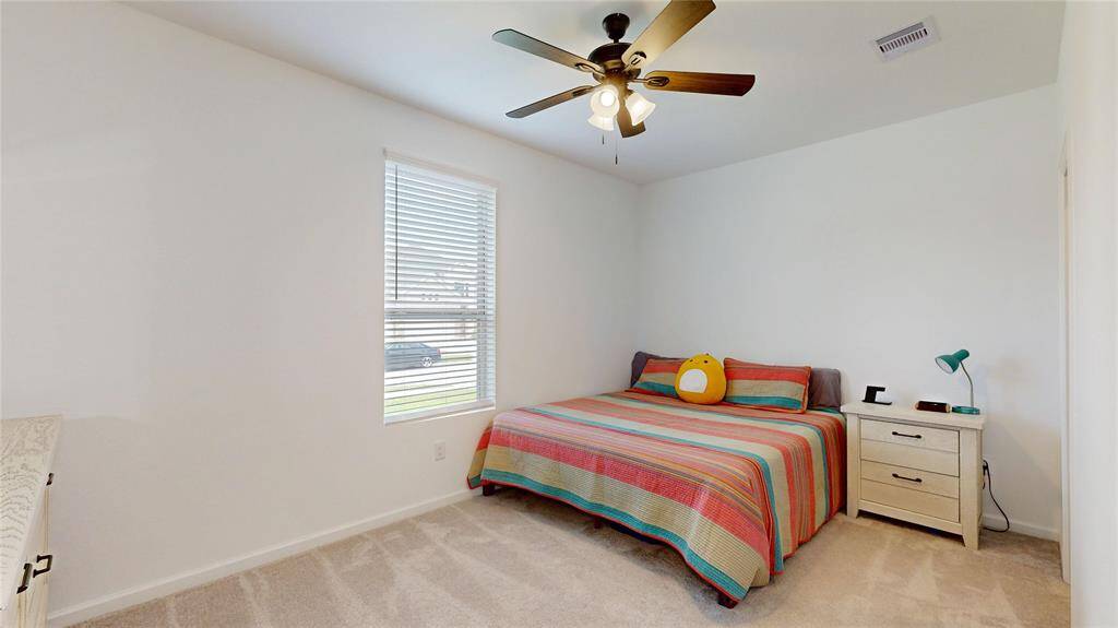 One of the Secondary Bedroom. Spacious and bright.