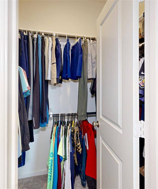 Spacious walk-in closet in the secondary bedroom.