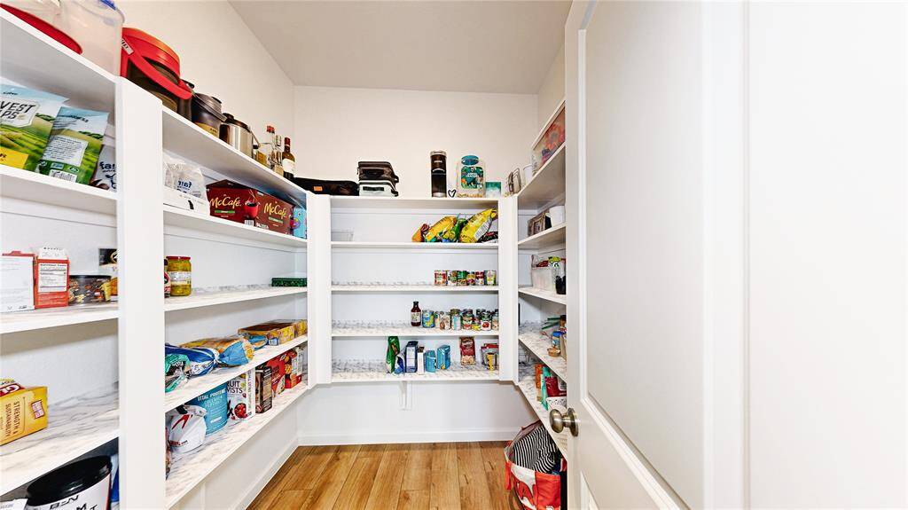 Enjoy abundant storage with this spacious walk-in pantry.