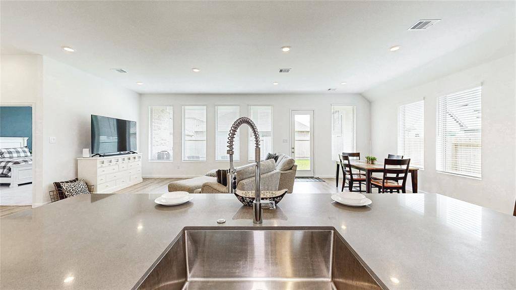 The kitchen seamlessly connects to the family room and dining area, perfect for modern living.