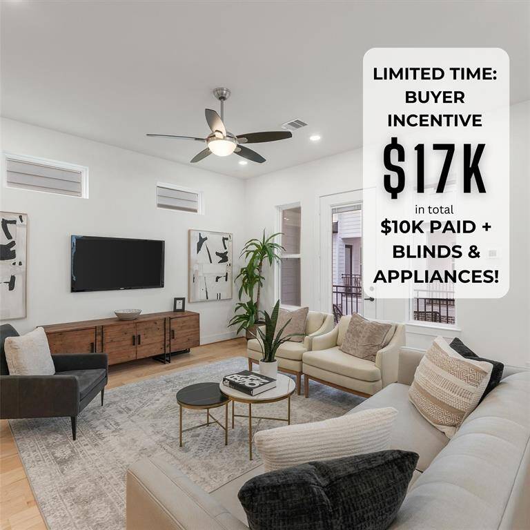 As you enter the second level, your well-lit living room highlights a neutral color palette, with hardwood floors, a ceiling fan, and recessed lighting. French doors open to your private balcony space, adding to the airy feel of the room.