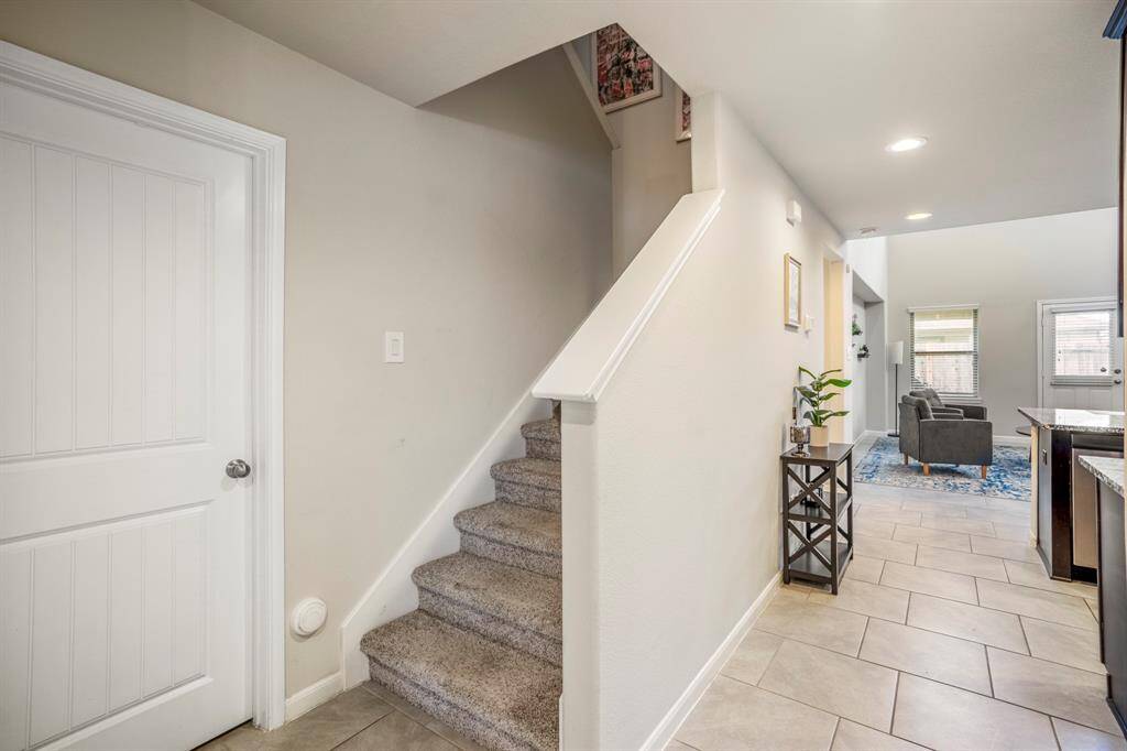 The stairs leading to the second floor living of the home.