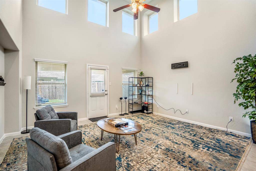 The family room is huge and has lots of windows that stream in natural light.