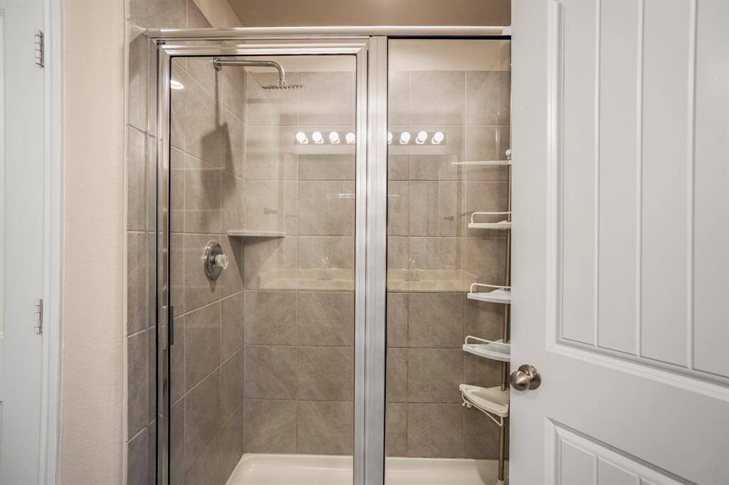 A large tiled separate shower is in the primary en-suite.