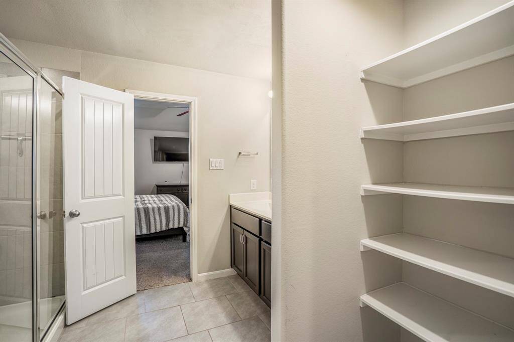 There is a linen closet space in the primary bedroom bathroom.