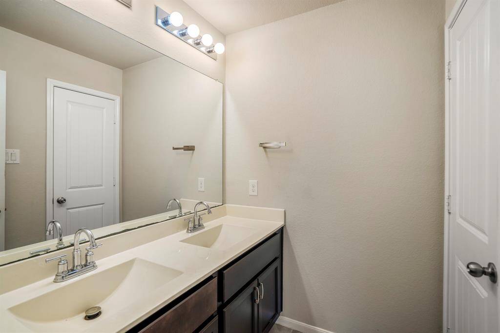 Lots of lighting over the mirror in the bathroom.