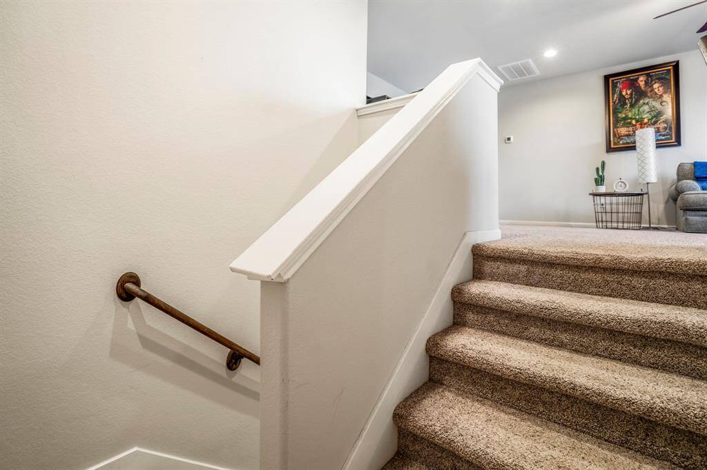 The stairs going to the second level of the home.