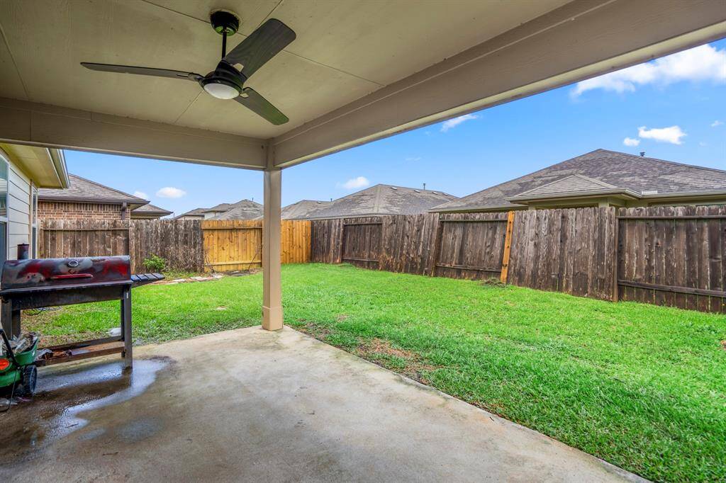 The backyard from the covered patio.