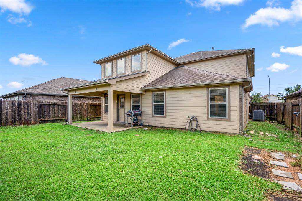The backyard is fully fenced and offers a fun and safe environment for children and pets to play.