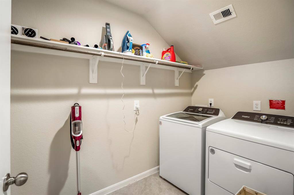 The laundry room is spacious enough to store your vacuum cleaner as well as offering hanging space for those items just out of the washer.