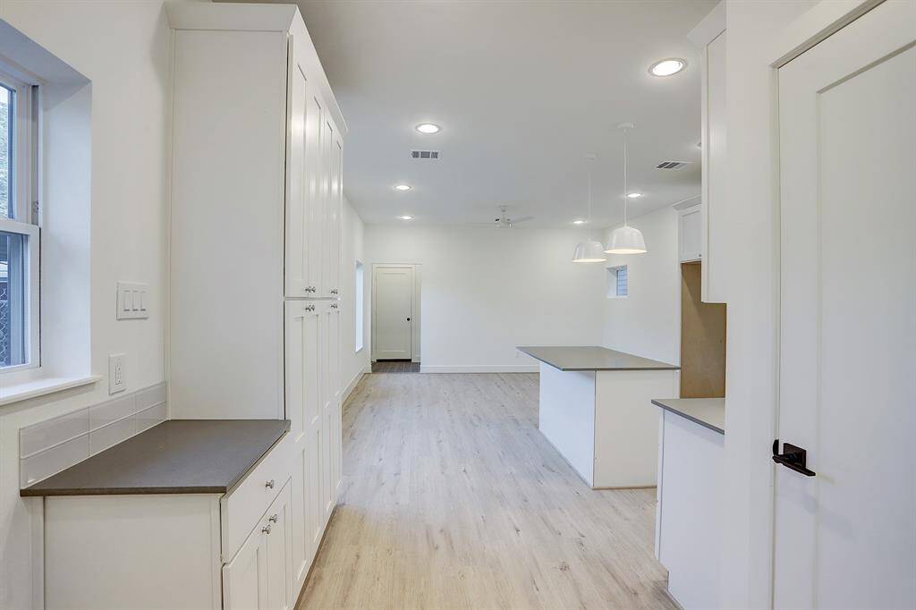 Upstairs kitchen with updated appliances.