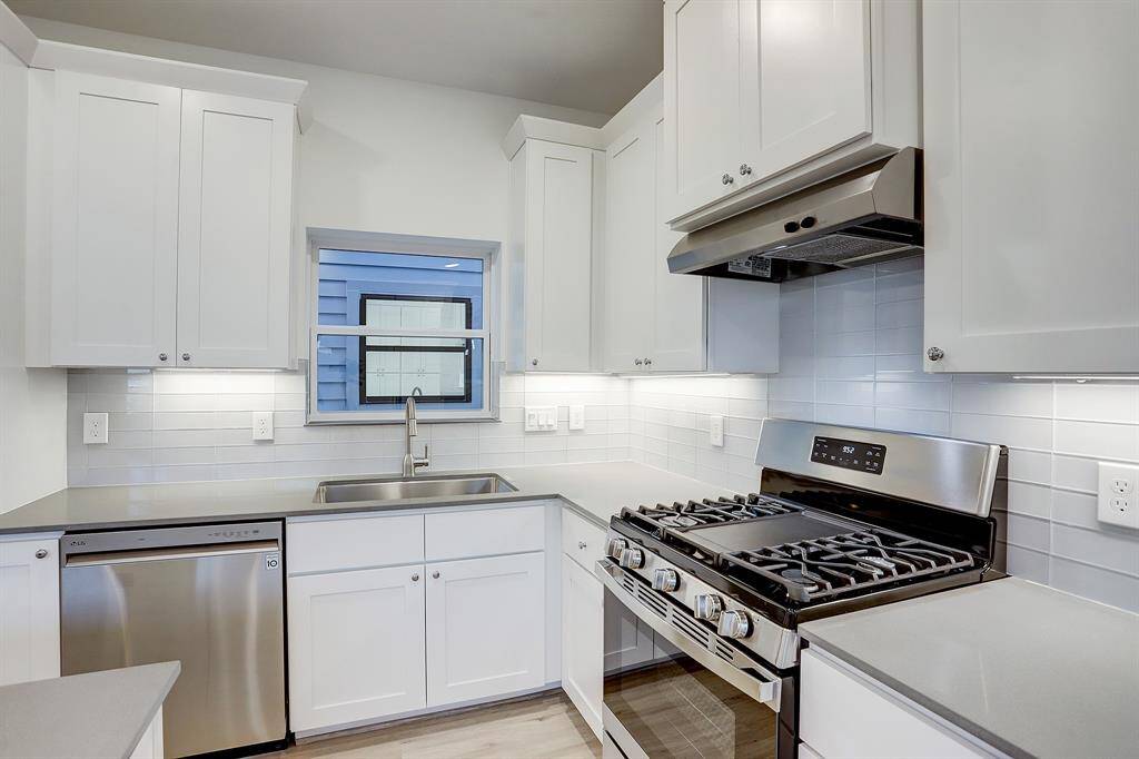Spacious kitchen with ample amount of cabinetry.