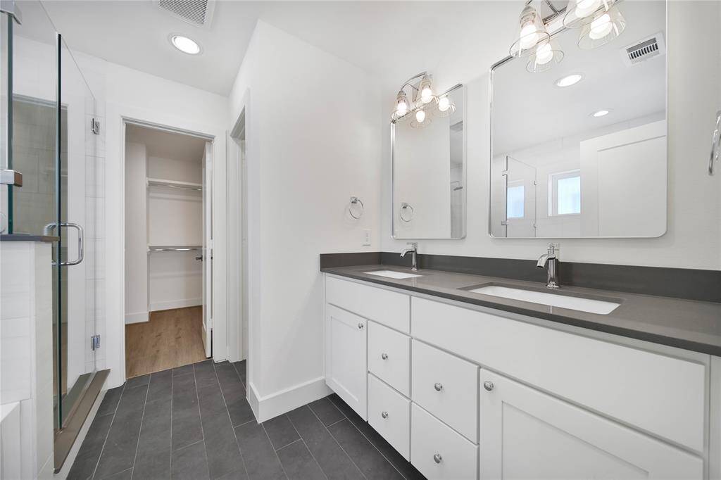 Primary bathroom features double sinks.