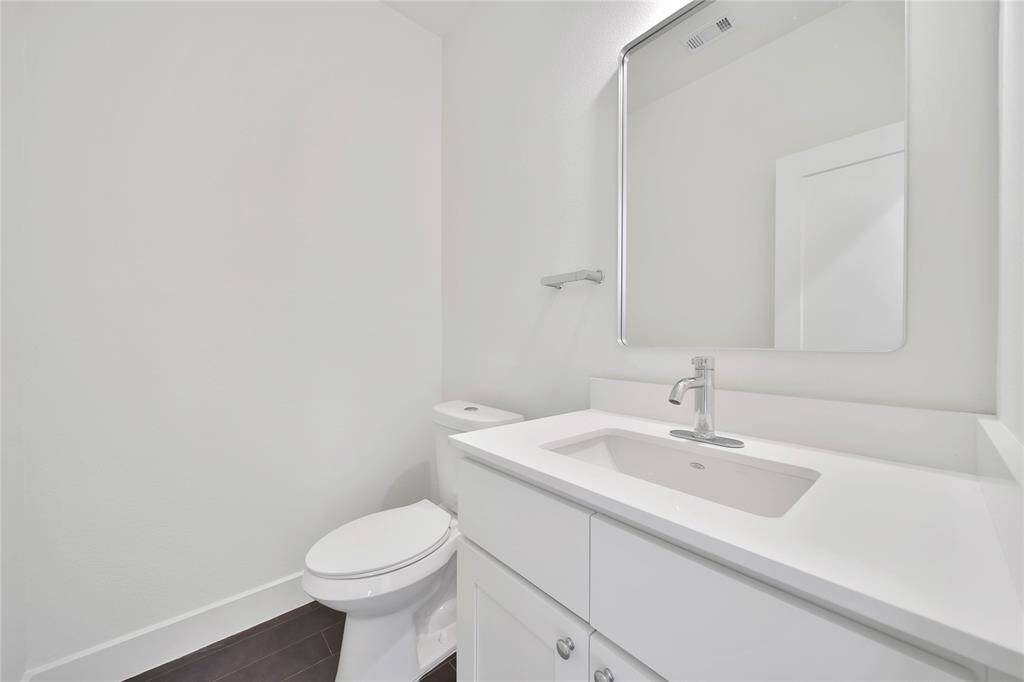 Downstairs half bath located perfectly off the main living space.