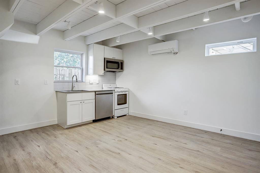 Spacious downstairs living area with kitchenn for the 1 bedroom 1 bath space.