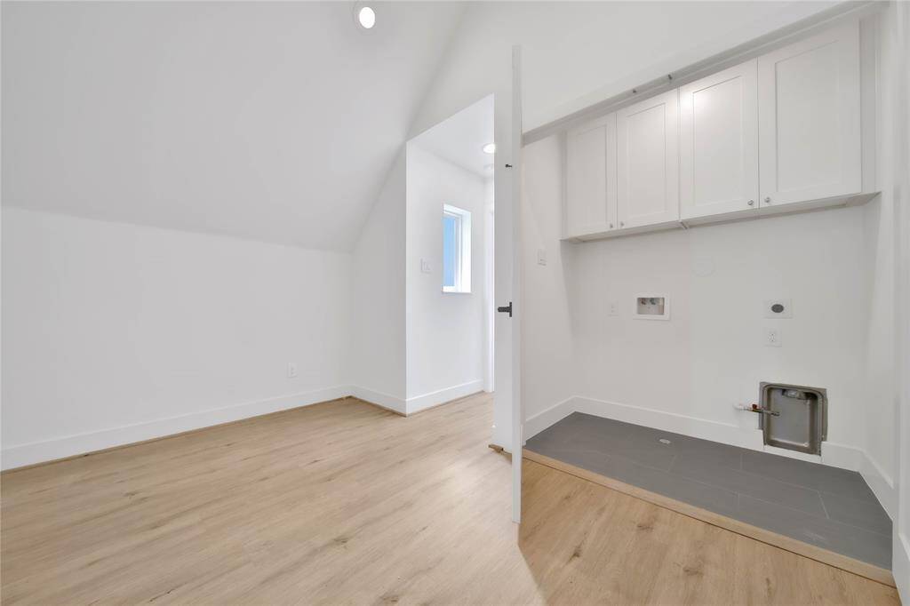 Large utility room with plenty of storage.