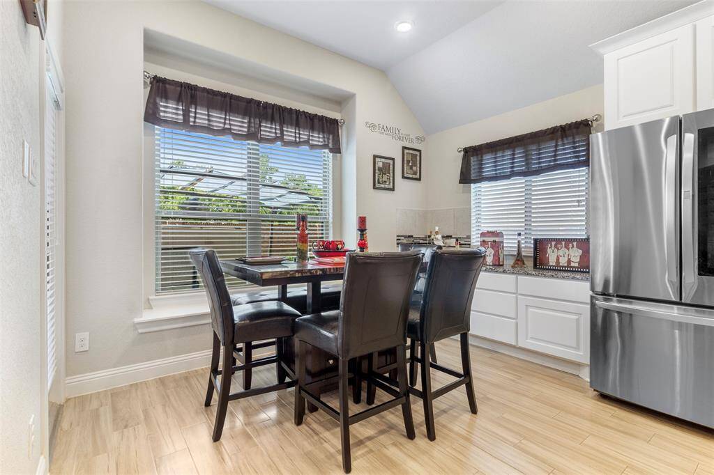 Dinette area overlooks backyard and a buffet off to the side is great for extra space and when entertaining.