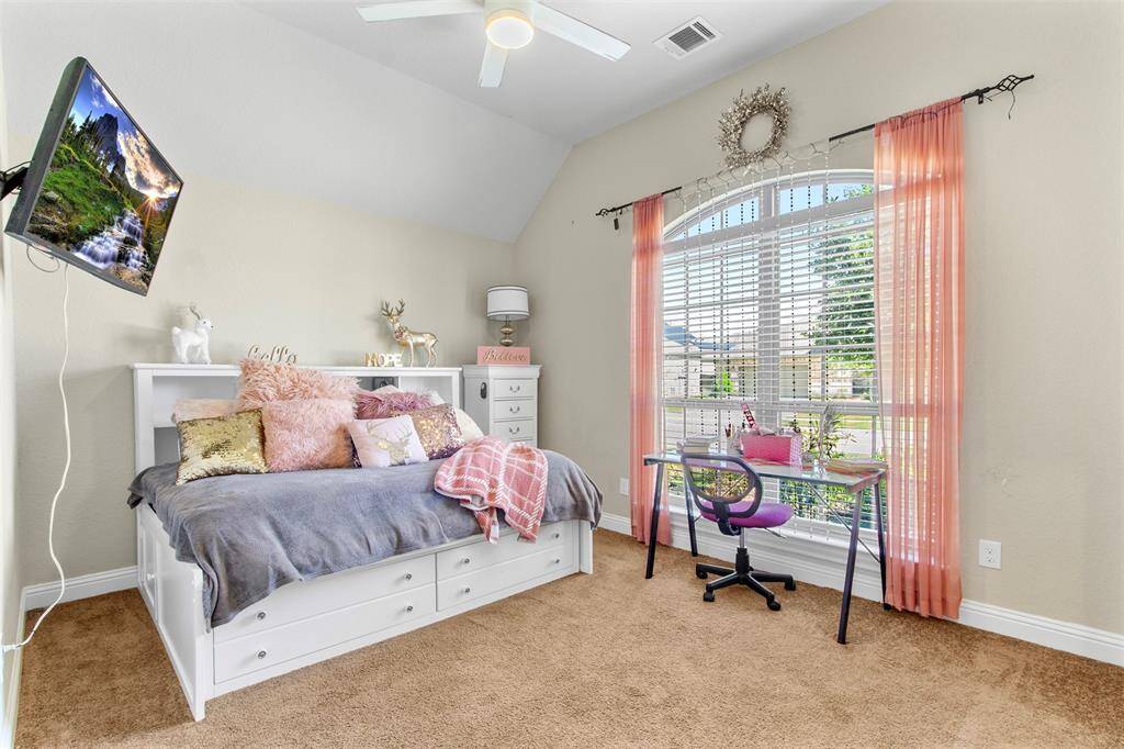 Secondary bedrooms are all large and accommodating. This secondary bedroom is at front of home and shares a Hollywood style bathroom with another large bedroom.