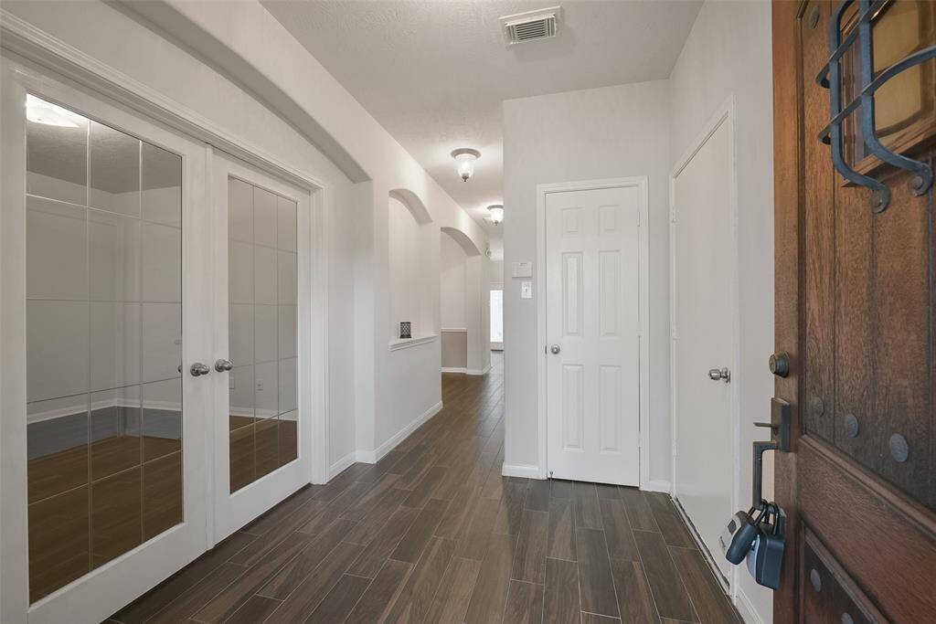 Home office on the 1st floor has French doors with leaded glass.