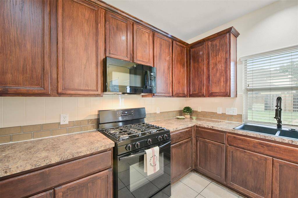 The kitchen has a gas range and refrigerator comes with the house.