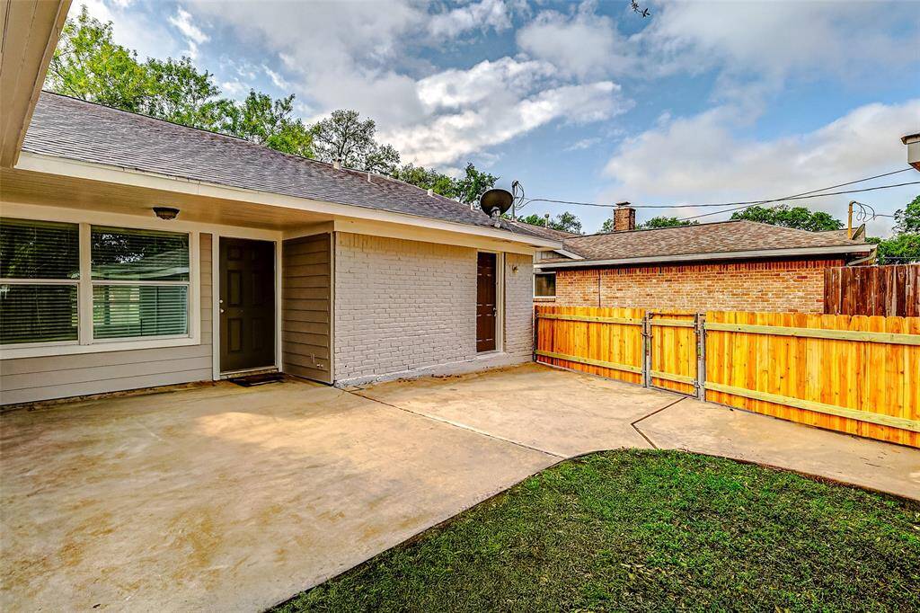Step outside to discover a peaceful retreat, complete with a spacious concrete patio—ideal for outdoor furniture and grilling, offering the perfect setting to unwind and enjoy the fresh air.