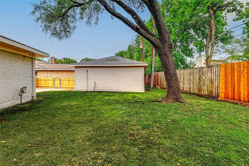 With plenty of green space for pets to roam or children to play, the backyard offers both freedom and fun. Plus, easy access to the detached garage adds convenience and functionality.
