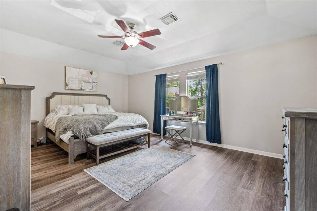 Primary suite with vaulted ceilings and walk in closets