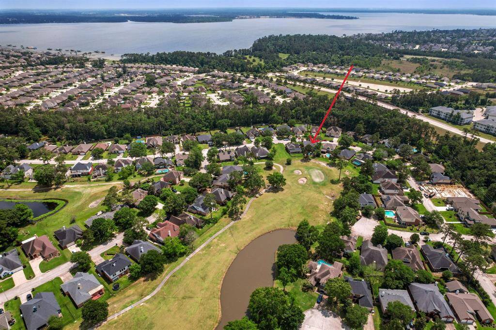 Aerial views of the home with views of the golf course