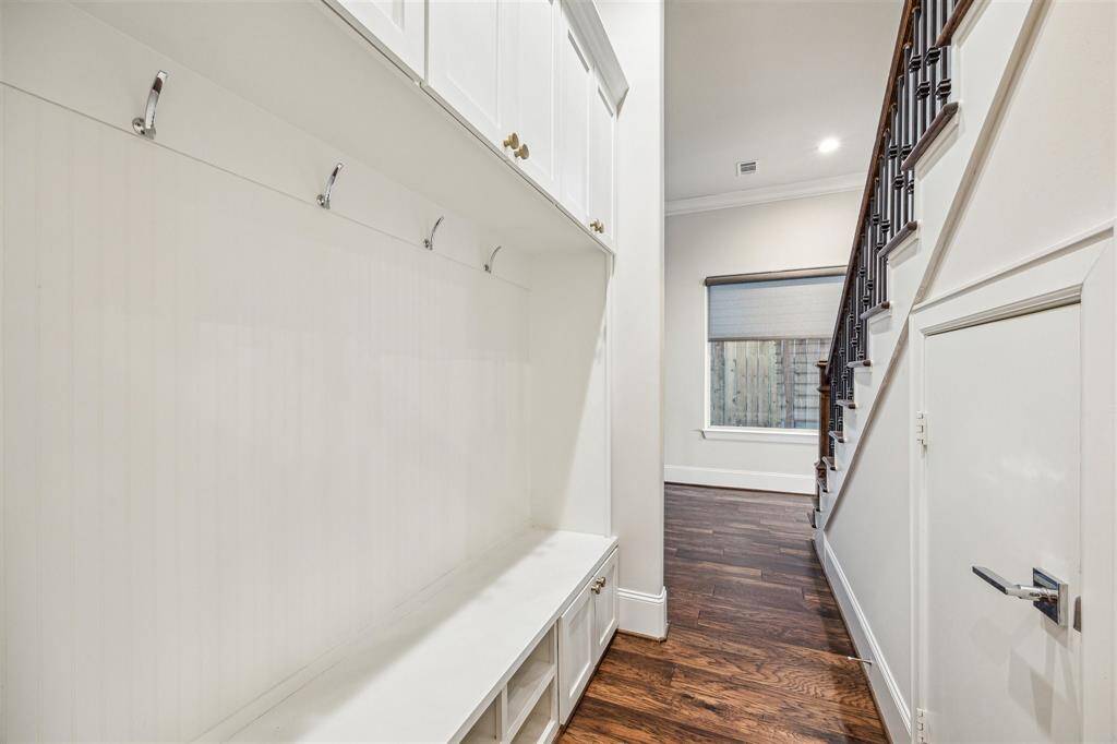 A well-designed mudroom area with built-in storage, hooks, and cubbies for added convenience.