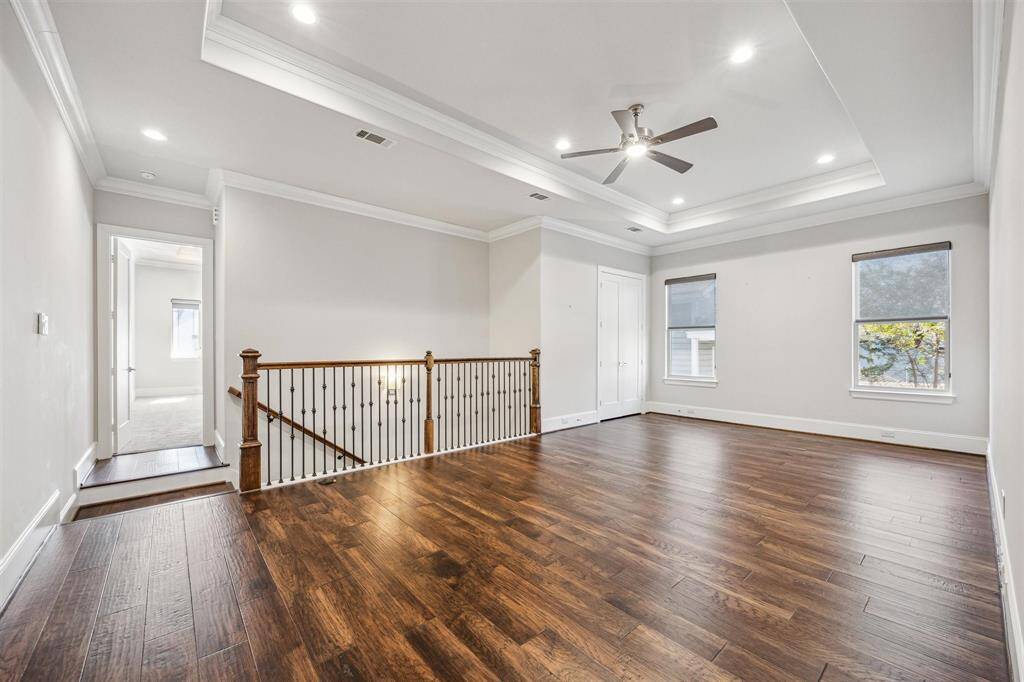 Alternate view of the upstairs game room providing ample space for lounging or entertainment.