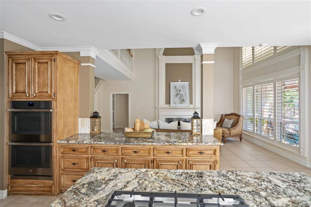 Double ovens and kitchen looking into the living room