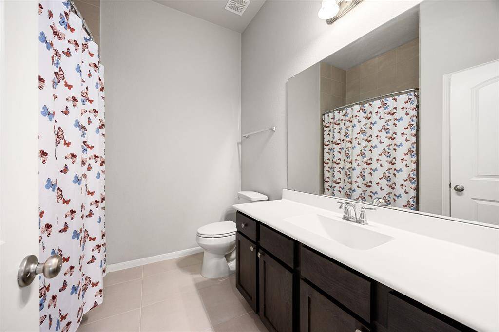Convenient upstairs third bathroom for added comfort.