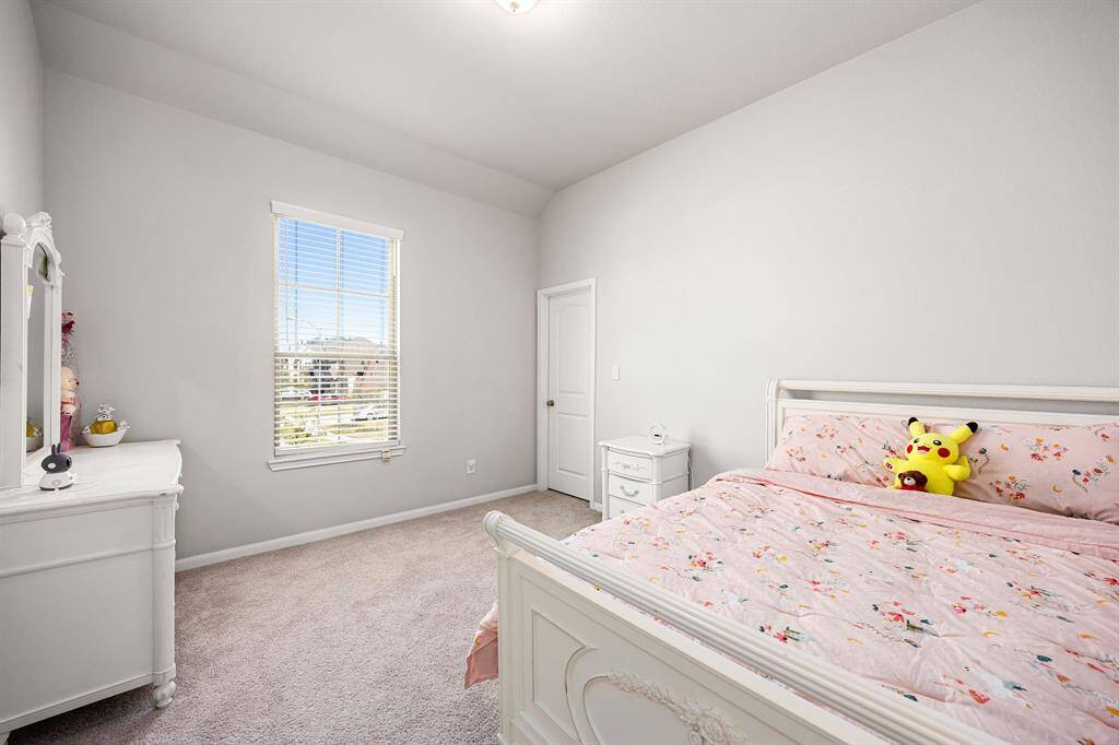 Cozy and bright fourth bedroom perfect for relaxation or a guest retreat.