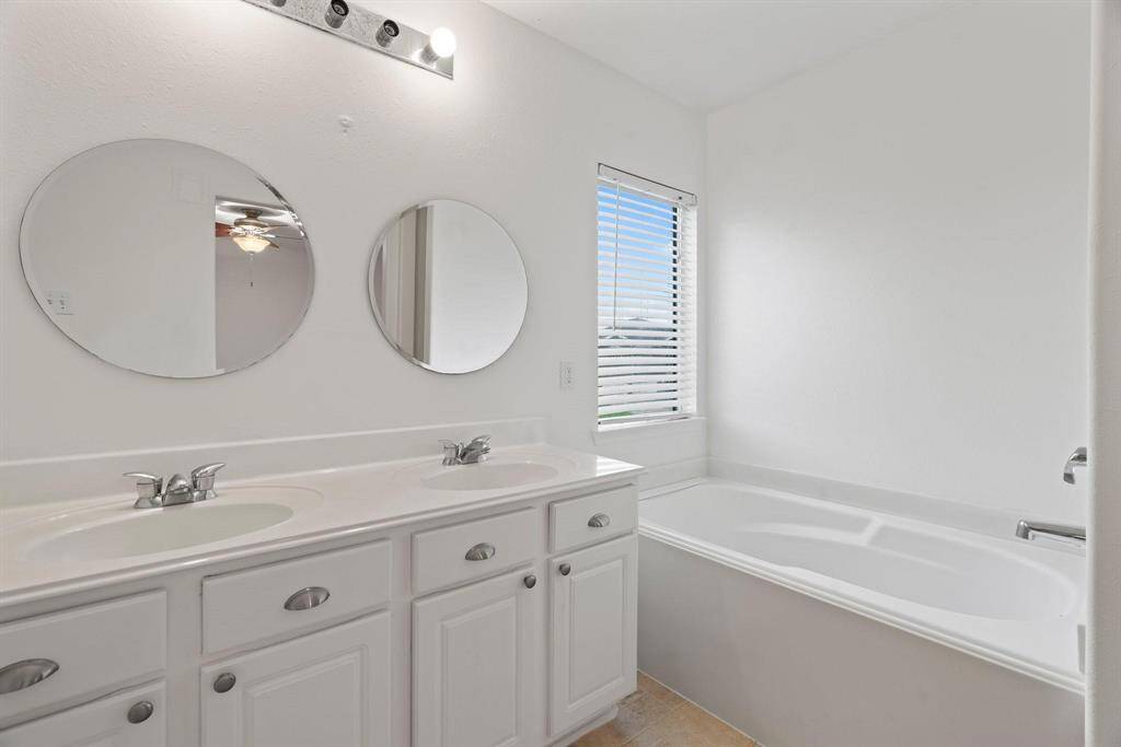 Primary bath with double vanity, large soaking tub and separate shower